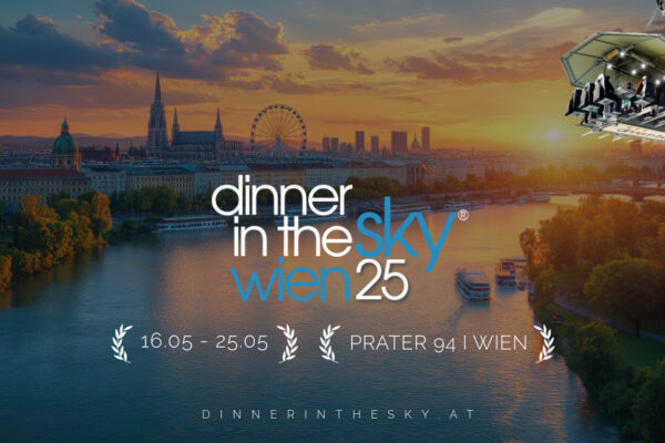 Guests enjoying a gourmet meal suspended high above Vienna with stunning city views
